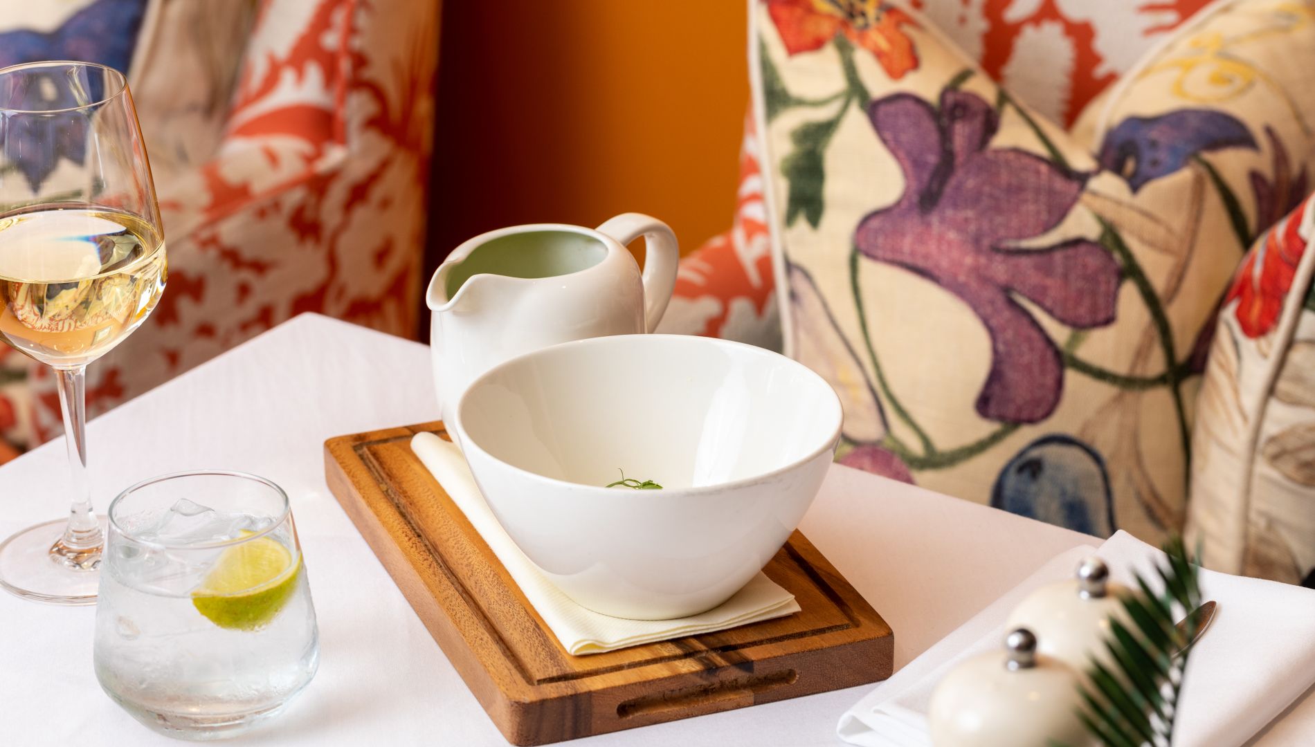 A Tea Set With A Teacup And A Glass Of Wine