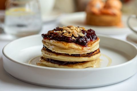 A Stack Of Pancakes On A Plate